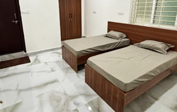 2-sharing AC room at Casavir Mens PG Madhapur, twin beds, wardrobe, marble flooring